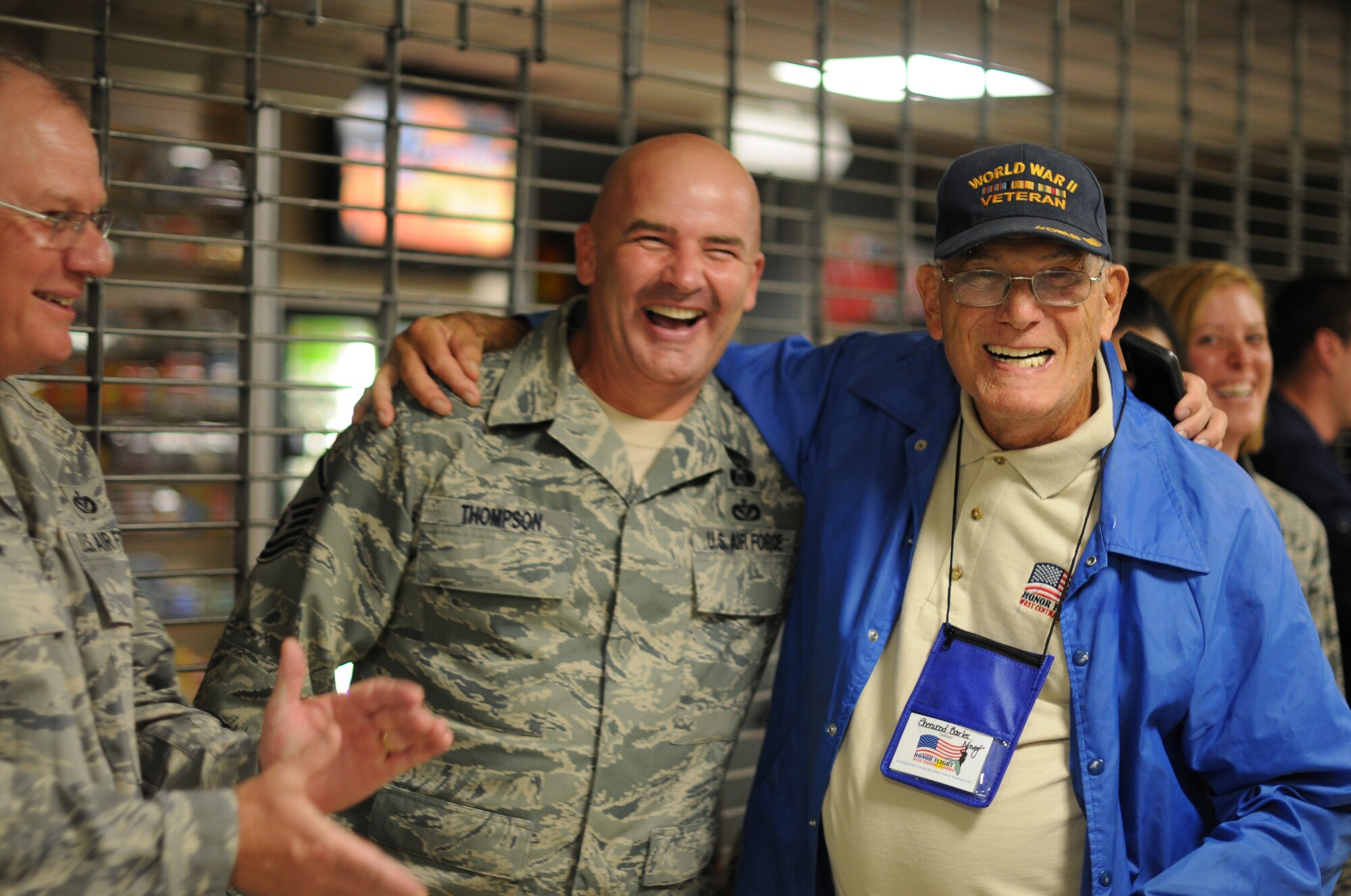 A picture of U.S. Air Force Airmen welcoming home veterans of World War II.