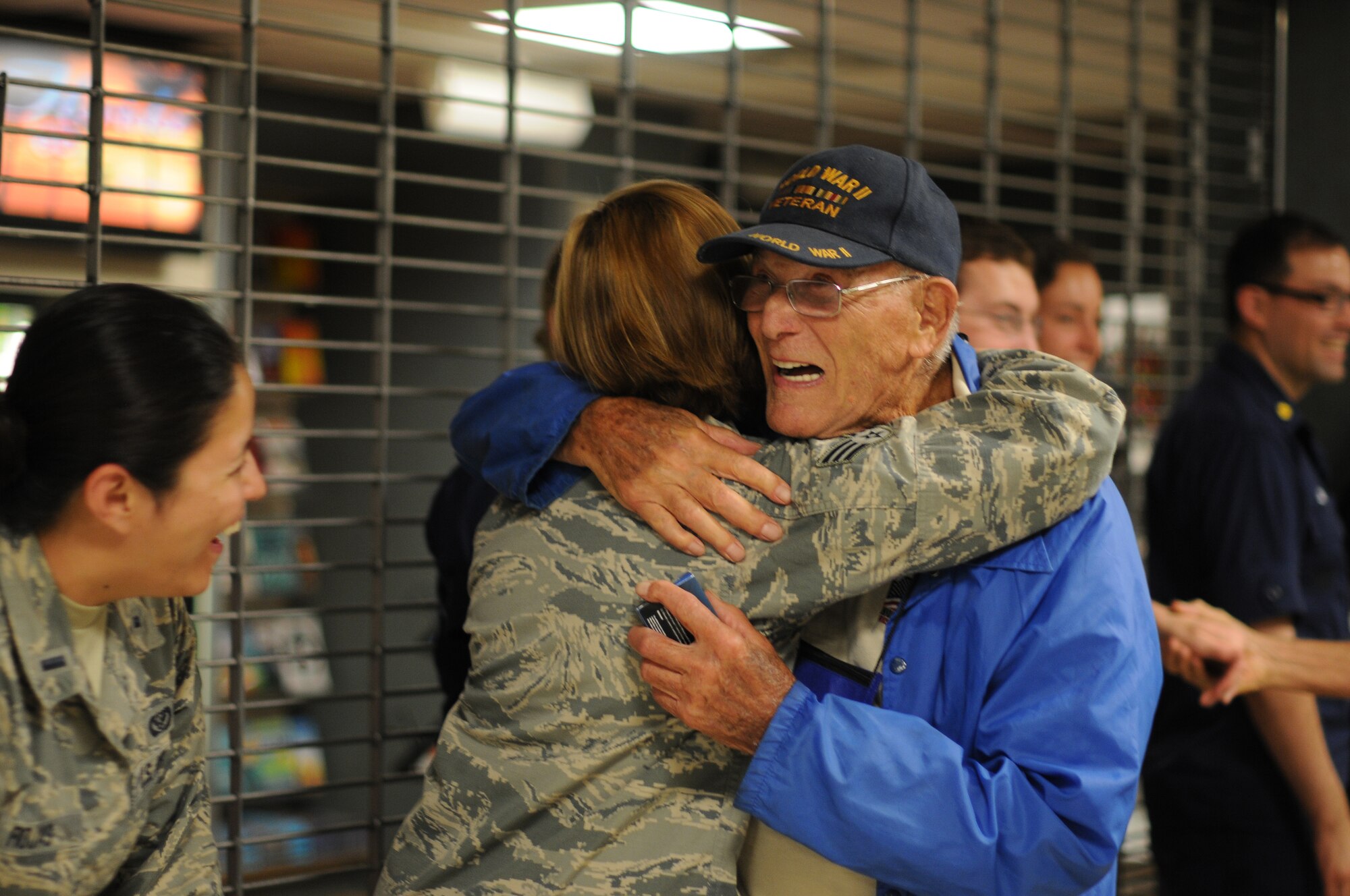 A picture of U.S. Air Force Airmen welcoming home veterans of World War II