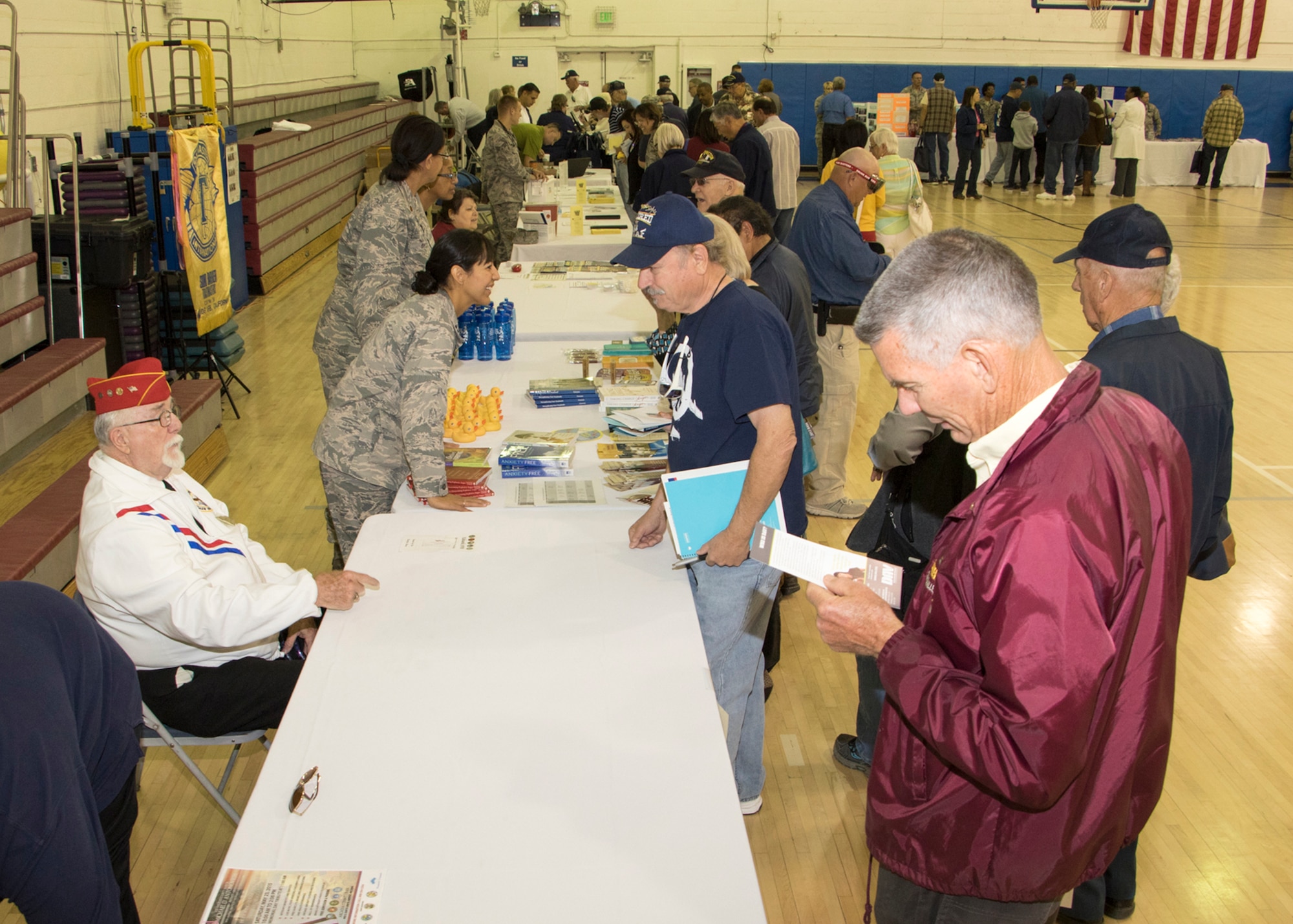 Approximately 400 military retirees, their families and surviving spouses were in attendance during the 2015 Military Retiree Appreciation Day event held at the Oasis Community Center and 27 information booths were set up throughout the fitness center basketball court May 16. (U.S. Air Force photo by Brad White)
