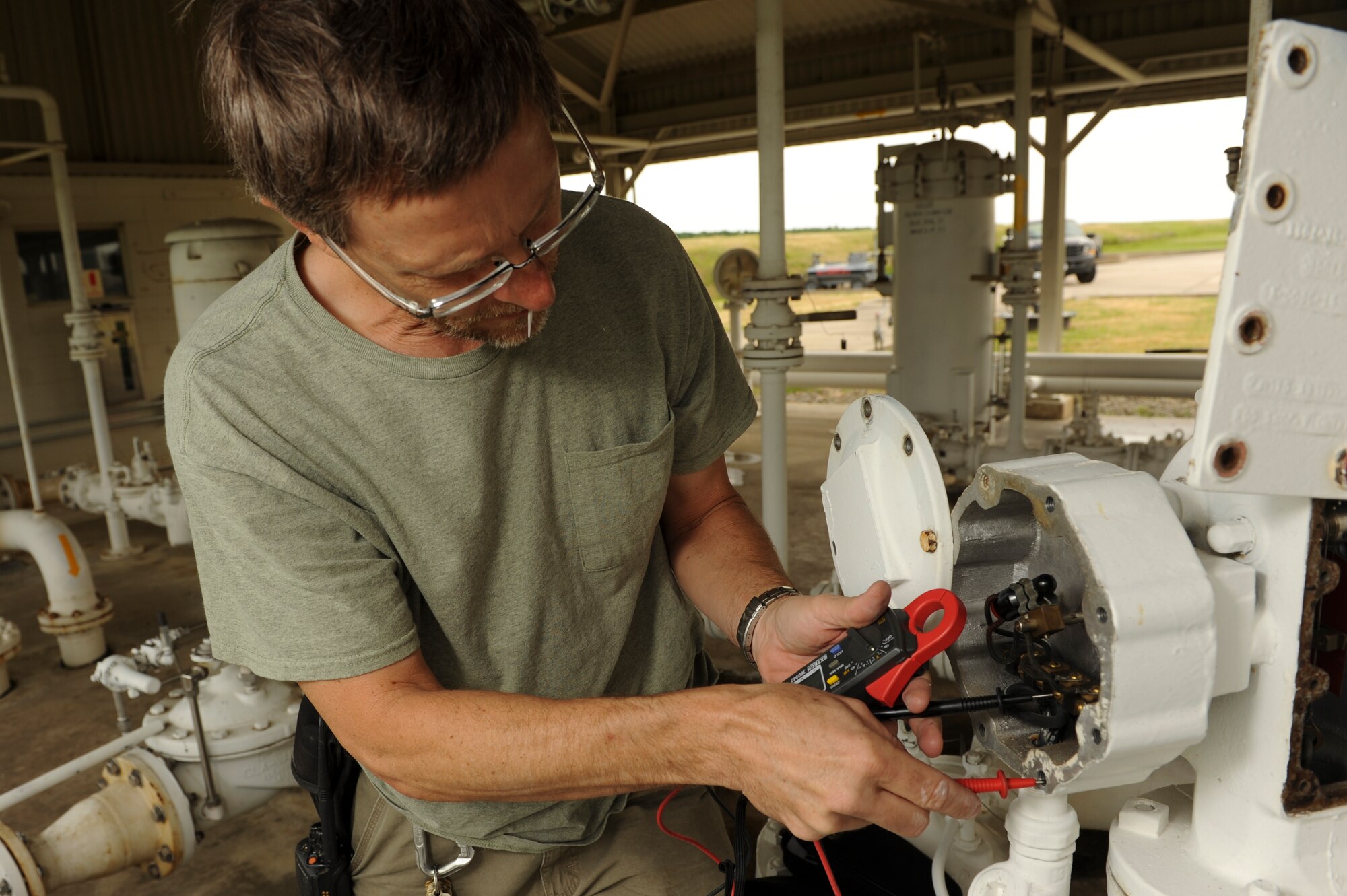James Buehring, 19th Civil Engineer Squadron liquid fuel maintenance technician, checks the voltage on a fuel meter May 12, 2015, at Little Rock Air Force Base, Ark. The 19th CES water and fuel shop maintains the base’s more than 130 miles of water and sewer lines. (U.S. Air Force photo by Senior Airman Scott Poe)  