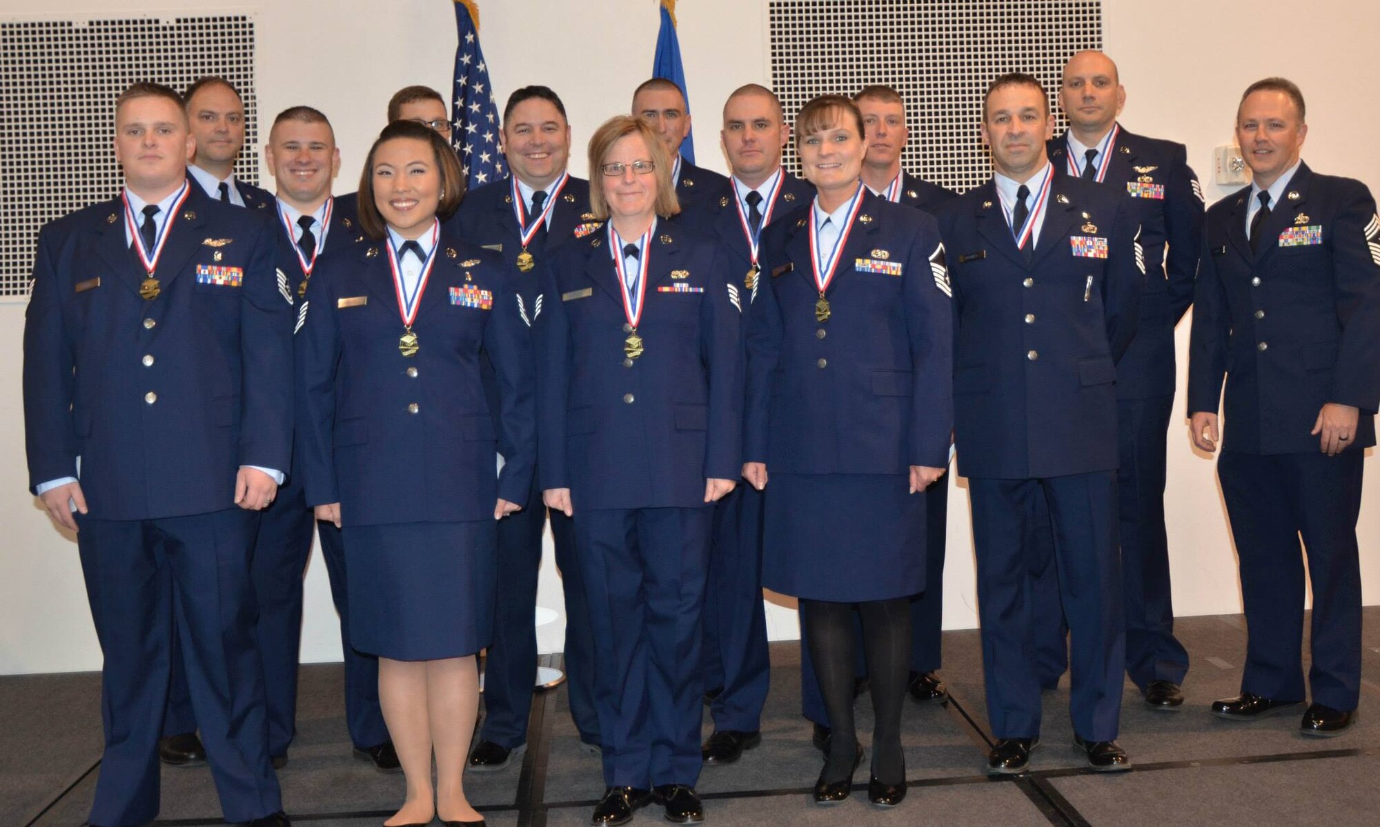 U.S. Air Force Airmen assigned to the 153rd Airlift Wing, Wyoming Air National Guard, pose for a picture prior to the Community College of The Air Force Graduation ceremony May.02, 2015 at  F.E. Warren AFB in Cheyenne, Wyoming. (U.S. Air National Guard photo by Tech. Sgt. John Galvin/released)