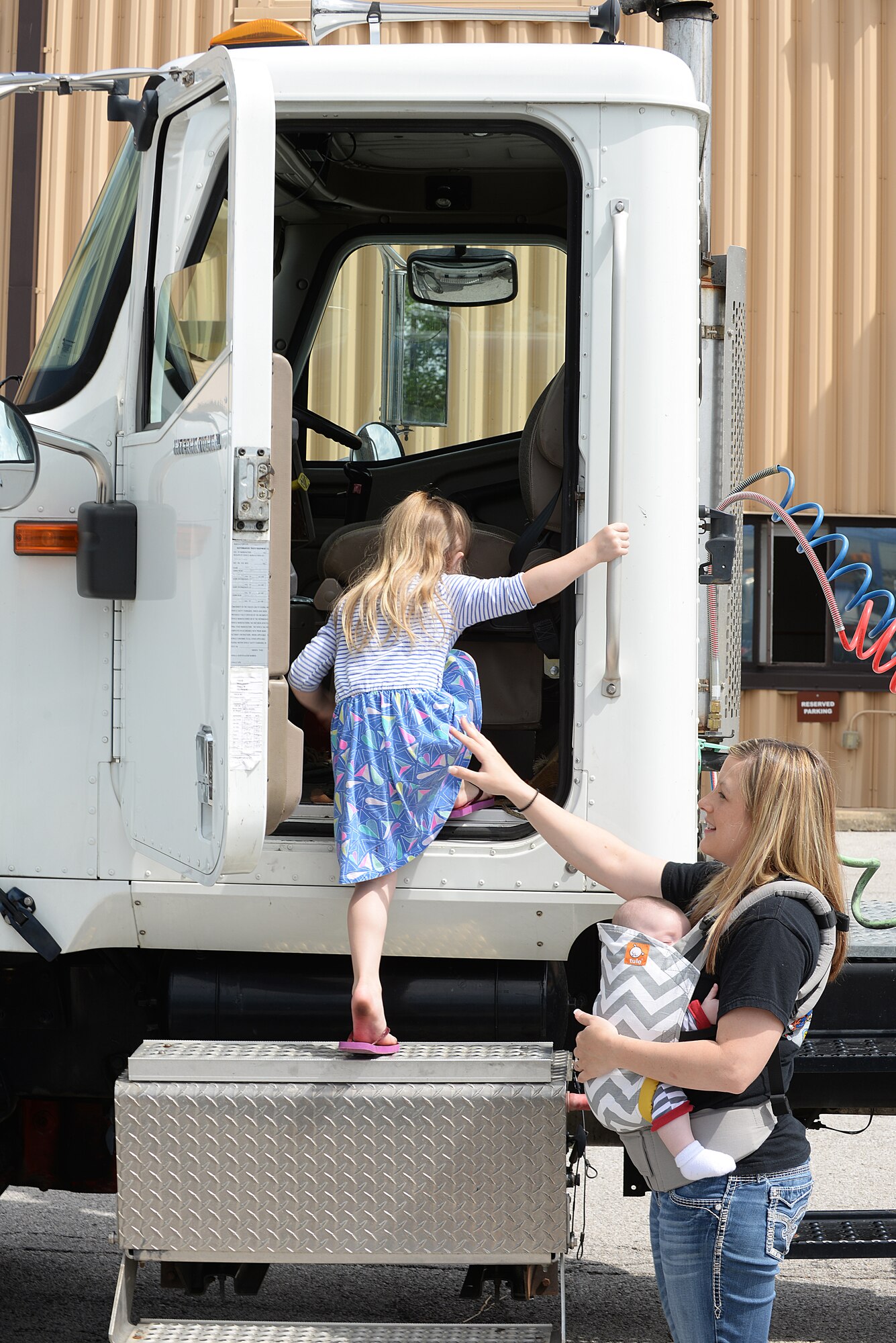 Scott Air Force Base members and their families got the opportunity to attend an Open House event put on by the 375 Logistics Readiness Squadron at Vehicle Operations Bldg. 548 May 15, 2015 at Scott AFB, Illinois. The 375 LRS had static displays for visitors to experience what it is like to sit behind the wheel of the many different vehicles they utilize. (U.S. Air Force photo/Senior Airman Joshua Eikren)