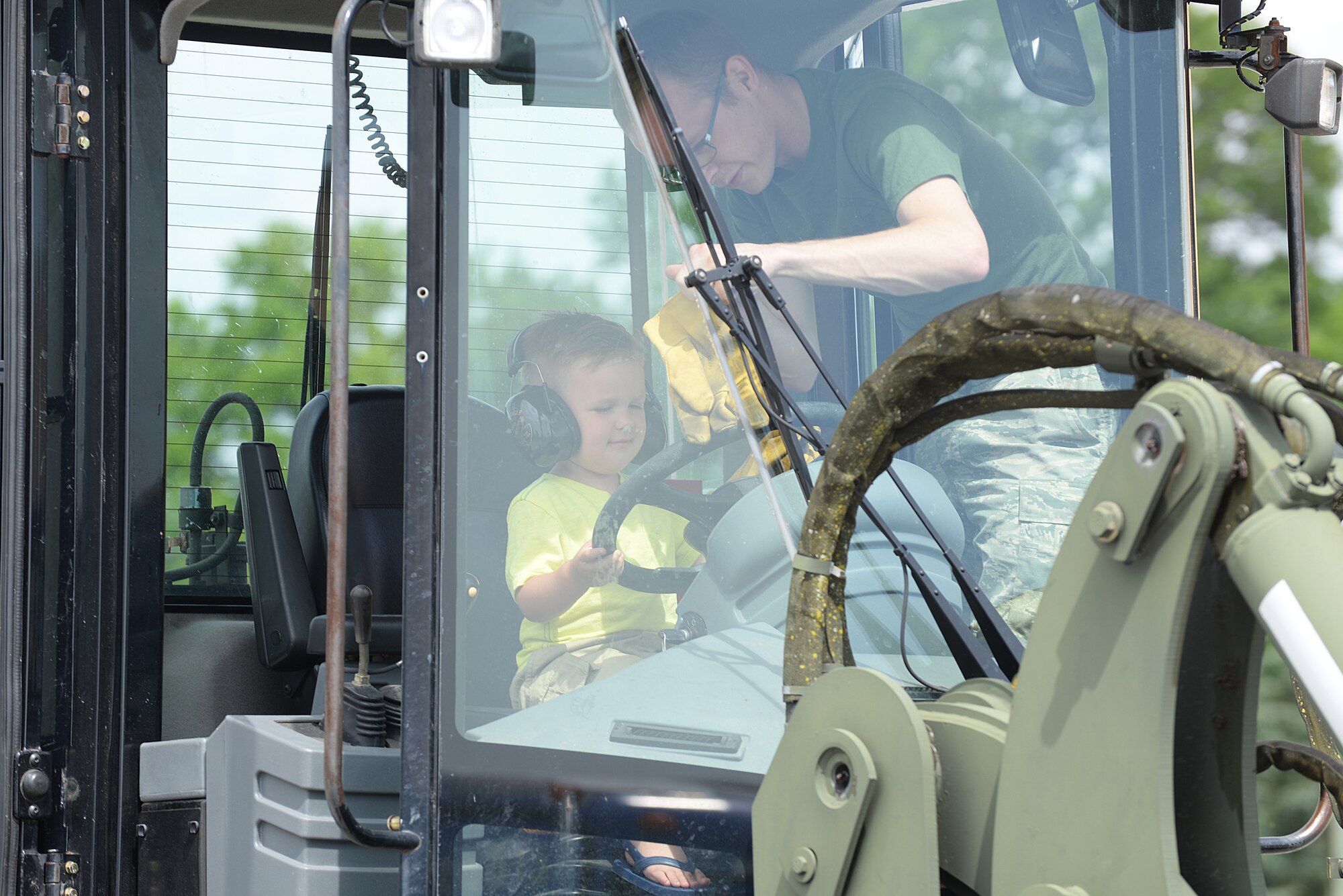 Scott Air Force Base members and their families got the opportunity to attend an Open House event put on by the 375 Logistics Readiness Squadron at Vehicle Operations Bldg. 548 May 15, 2015 at Scott AFB, Illinois. The 375 LRS had static displays for visitors to experience what it is like to sit behind the wheel of the many different vehicles they utilize. (U.S. Air Force photo/Senior Airman Joshua Eikren)