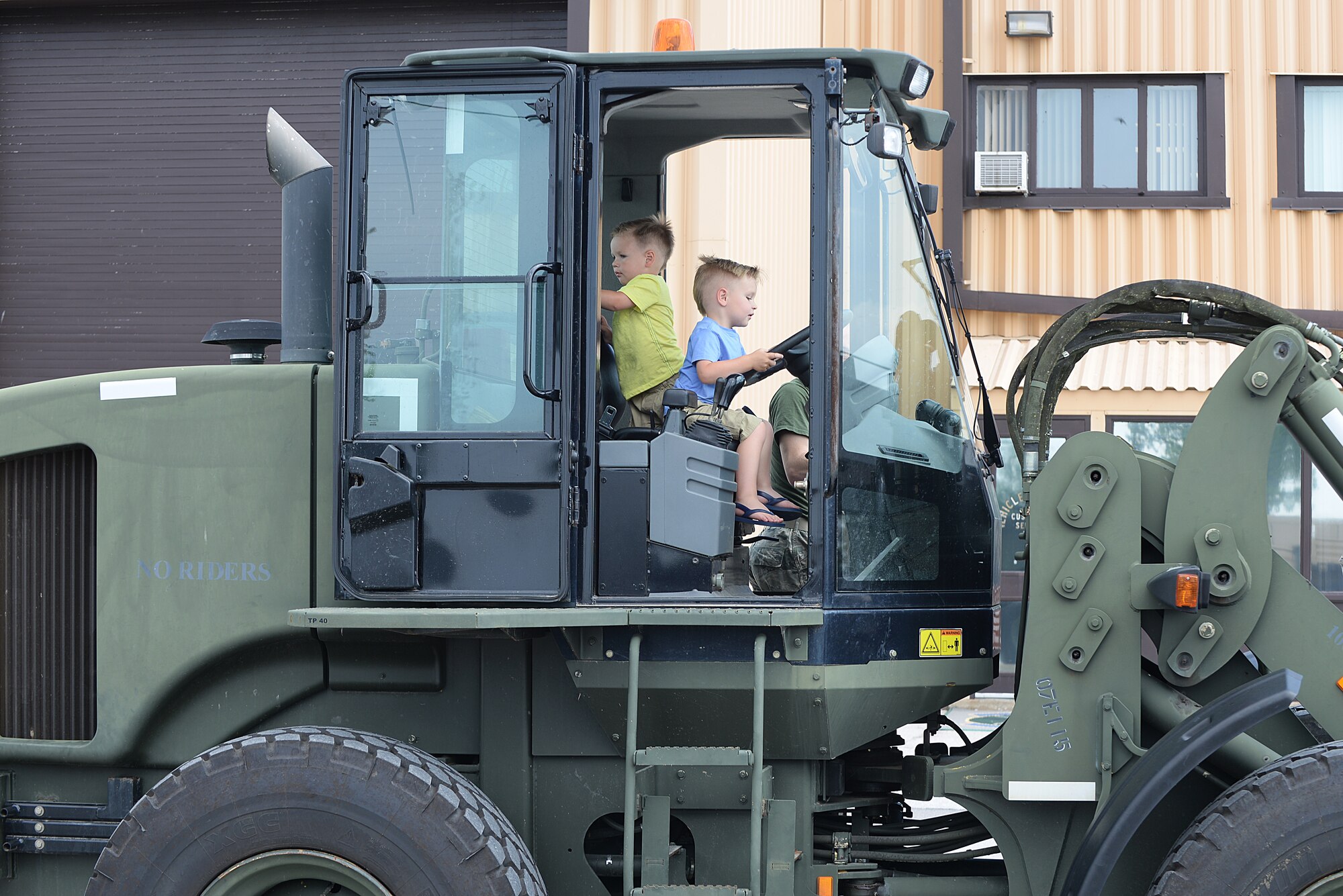 Scott Air Force Base members and their families got the opportunity to attend an Open House event put on by the 375 Logistics Readiness Squadron at Vehicle Operations Bldg. 548 May 15, 2015 at Scott AFB, Illinois. The 375 LRS had static displays for visitors to experience what it is like to sit behind the wheel of the many different vehicles they utilize. (U.S. Air Force photo/Senior Airman Joshua Eikren)