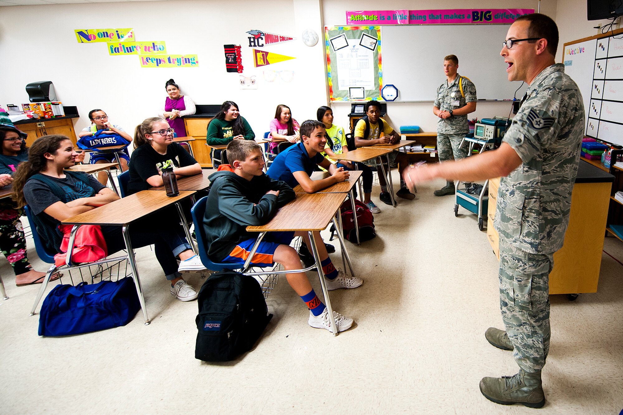 U.S. Air Force Staff Sgt. James D. Ault, 312th Training Squadron instructor, talks to 8th grade students at Lee Middle School in San Angelo, Texas, May 19, 2015. Ault and his fellow Special Instruments Training teammates visited the school to show students how science applies to their job in the Air Force. (U.S. Air Force photo by Airman 1st Class Devin Boyer/Released)