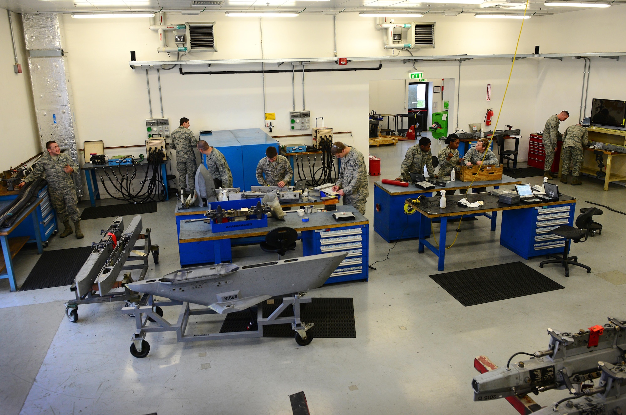 U.S. Air Force armament technicians from the 31st Munitions Squadron inspect weapons from an F-16 Fighting Falcon, May 20, 2015, at Aviano Air Base, Italy. Armament Airmen from the 31st Munitions Squadron and 31st AMXS are responsible for loading weapons onto aircraft, performing function checks and repairing munitions parts. (U.S. Air Force photo by Senior Airman Matthew Lotz/Released)