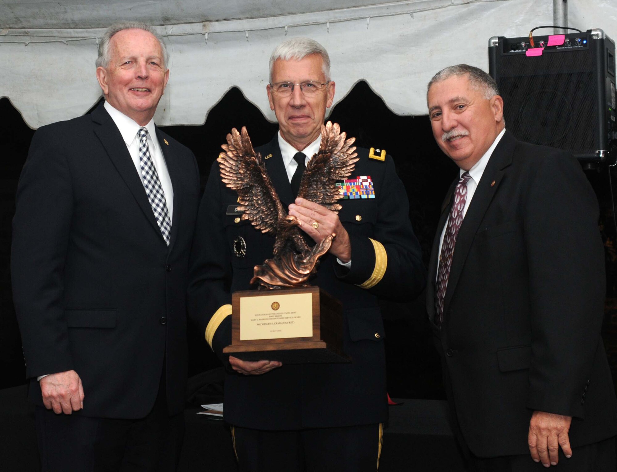 James Donahue (left), Association of the United States Army William Penn Chapter president and Hank Zola, AUSA First Region president, present retired Maj. Gen. Wesley Craig, formerly The Adjutant General of the Pennsylvania National Guard, the Mary G. Roebling Distinguished Service Award during the closing ceremonies of the AUSA regional meeting sponsored by the William Penn Chapter of AUSA, Washington Crossing Historic Park, Washington Crossing, Pennsylvania on May 16, 2015. (U.S. Air National Guard photo by Tech. Sgt. Andria Allmond/Released)