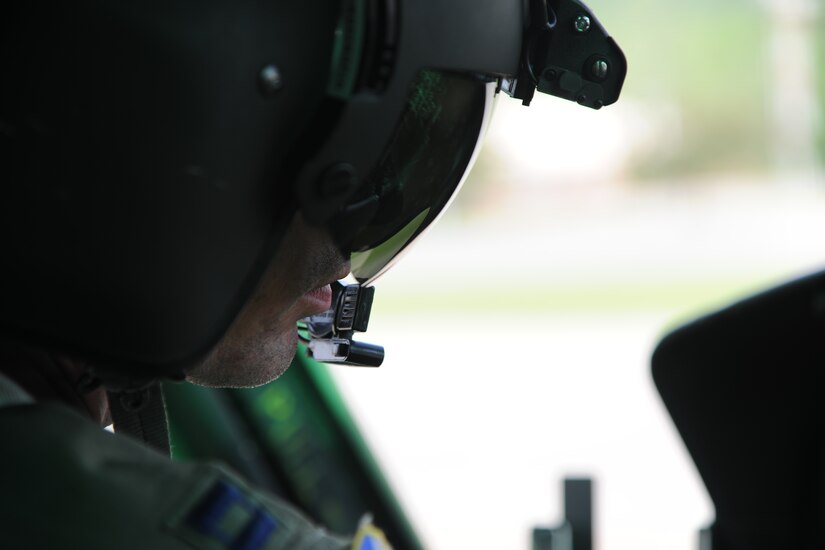 Capt. Graham Alsbrooks, 1st Helicopter Squadron special missions pilot, checks takeoff data at Camp Dawson, W.Va., May 15, 2015.  The 1st Helicopter Squadron trained as part of the Capital Response 15 and Aeolis 15 natural disaster exercises. (U.S. Air Force photo/ Airman 1st Class J.D. Maidens)
