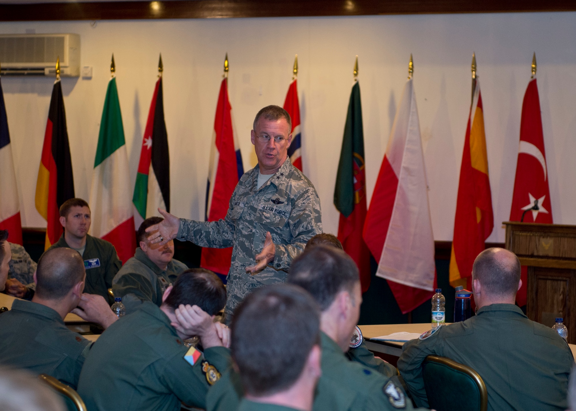 Maj. Gen. Lawrence M. Martin Jr., Assistant Deputy Under Secretary of the Air Force, International Affairs, speaks with Airmen during the Military Personnel Exchange Program forum on Royal Air Force Lakenheath, England, May 19, 2015. The program exchanges more than 130 Airmen with 26 countries worldwide, strengthening U.S. global relations. (U.S. Air Force photo by Senior Airman Nigel Sandridge/Released)