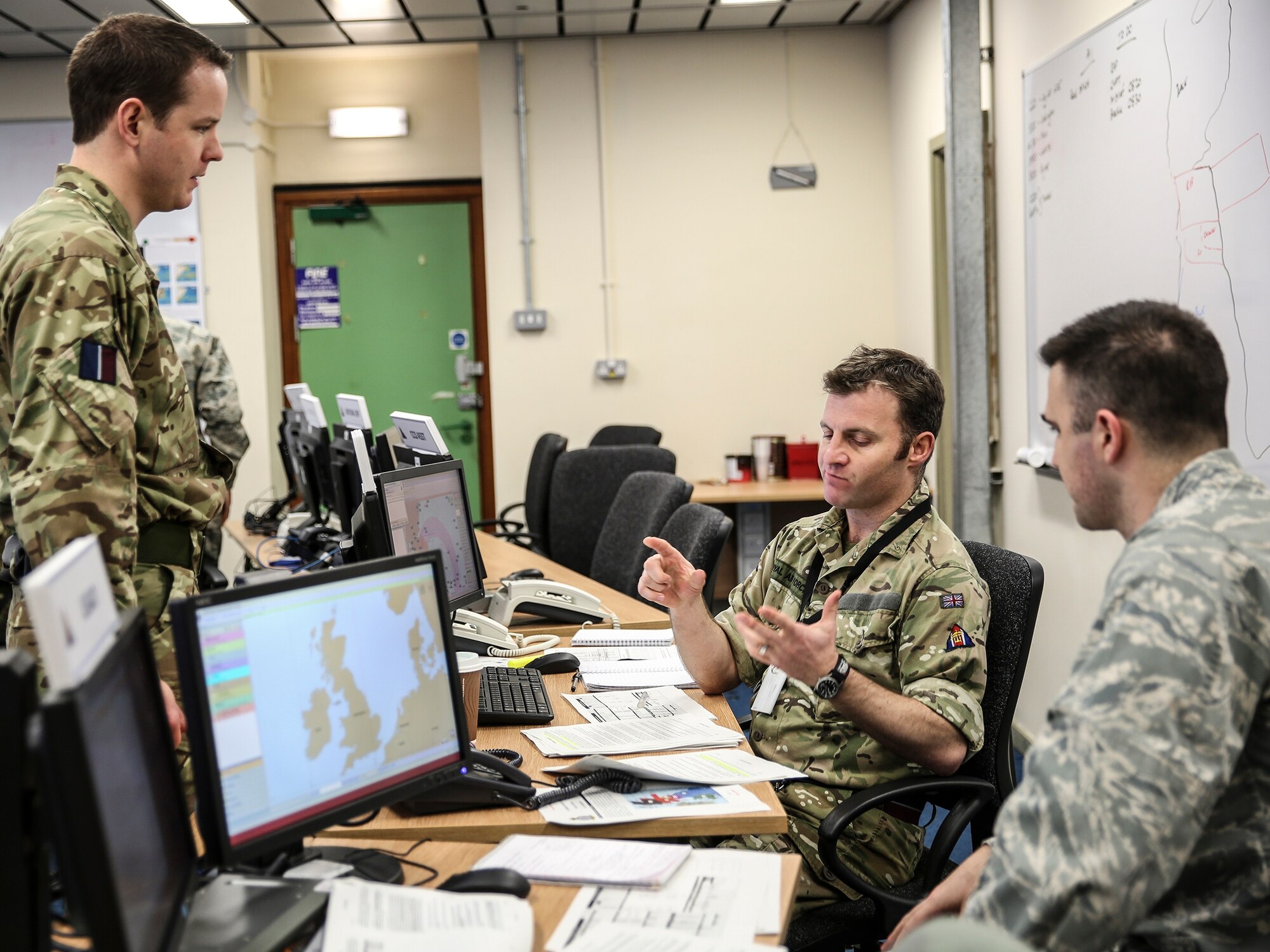 Maj. Dustin Lane, Royal Air Force High Wycombe judge advocate, interacts with his UK counterparts as part of the Military Personnel Exchange Program, Feb. 10, 2013. Lane is one of more than 130 Airmen worldwide assigned to a host-nation air force base for a three-year tour. (Courtesy photo)