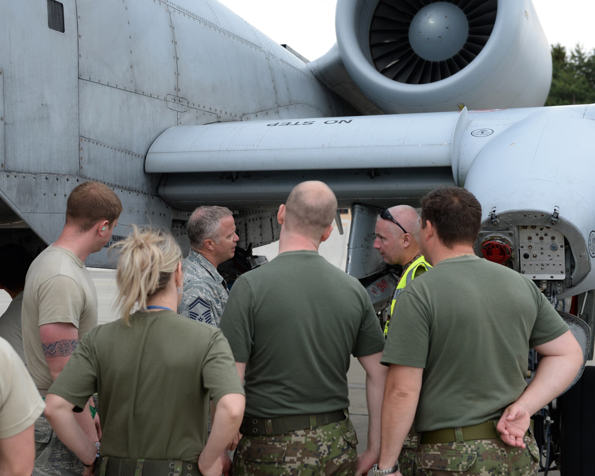 Two U.S. Air Force Airmen from the 354th Expeditionary Fighter Squadron give a tour of an A-10 Thunderbolt II attack aircraft assigned to the 354th EFS  to members of the Slovakia air force during a theater security package deployment at Sliac Air Base, Slovakia,  May 20, 2015. More than 40 Airmen from the 354th EFS deployed to Slovakia to participate in a theater security package in support of Operation Atlantic Resolve. (U.S. Air Force photo by Senior Airman Dylan Nuckolls/Released)