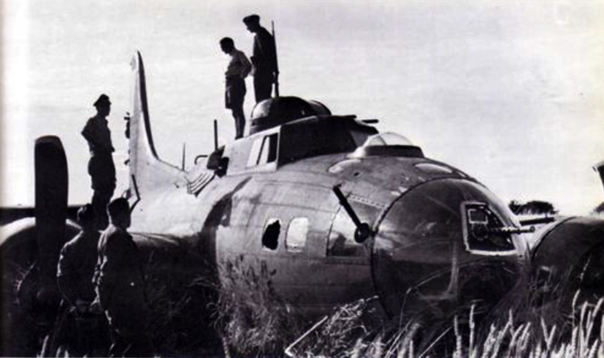 German soldiers examine a B-17 Flying Fortress during World War II, in Holland, 1943. During the war, two American B-17 Flying Fortresses, two British Halifax Bombers, one American P-51 Mustang and one American P-47 Thunderbolt crashed in the municipality of Giessenlanden as a result of air combat over Holland. Of the 36 aircrew members, 14 were killed and the others were captured by German forces. (Courtesy photo)