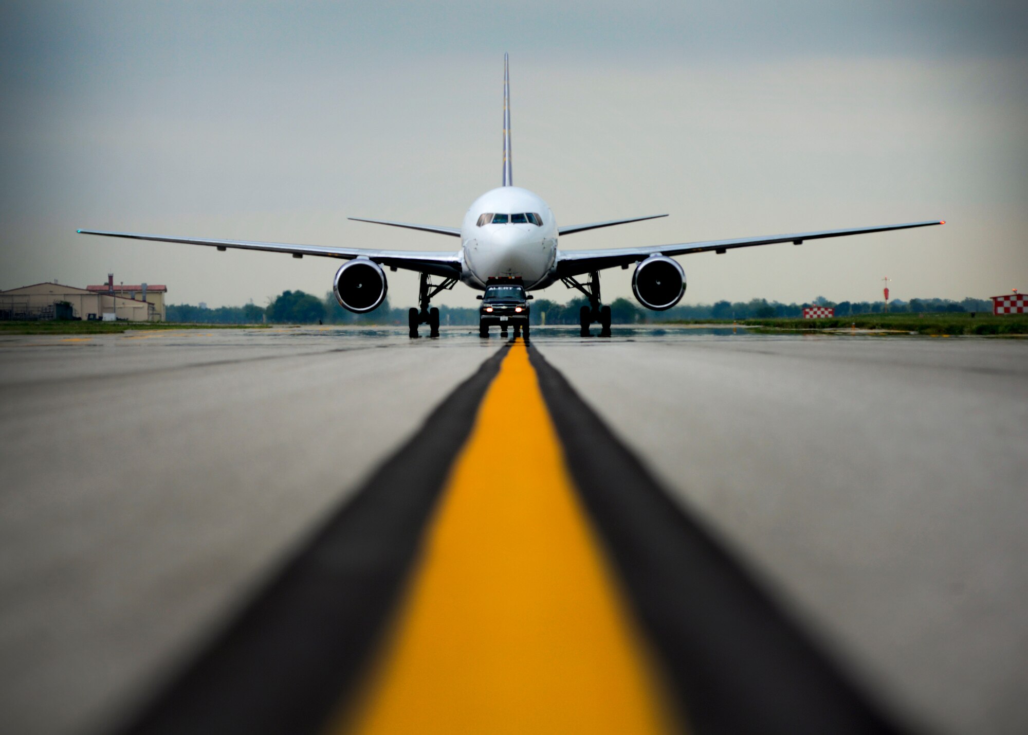 U.S. Air Force Airmen with the 31st Maintenance Squadron transient alert shop escort an incoming rotator with “follow me” service to a parking location, May 20, 2015, at Aviano Air Base, Italy. Transient alert Airmen also provide inflight emergency, air and ground service and departure assistance for transient aircraft. They recover and service more than 30 NATO, civilian and foreign aircraft per month that pass through Aviano. (U.S. Air Force photo by Senior Airman Areca T. Wilson/Released)