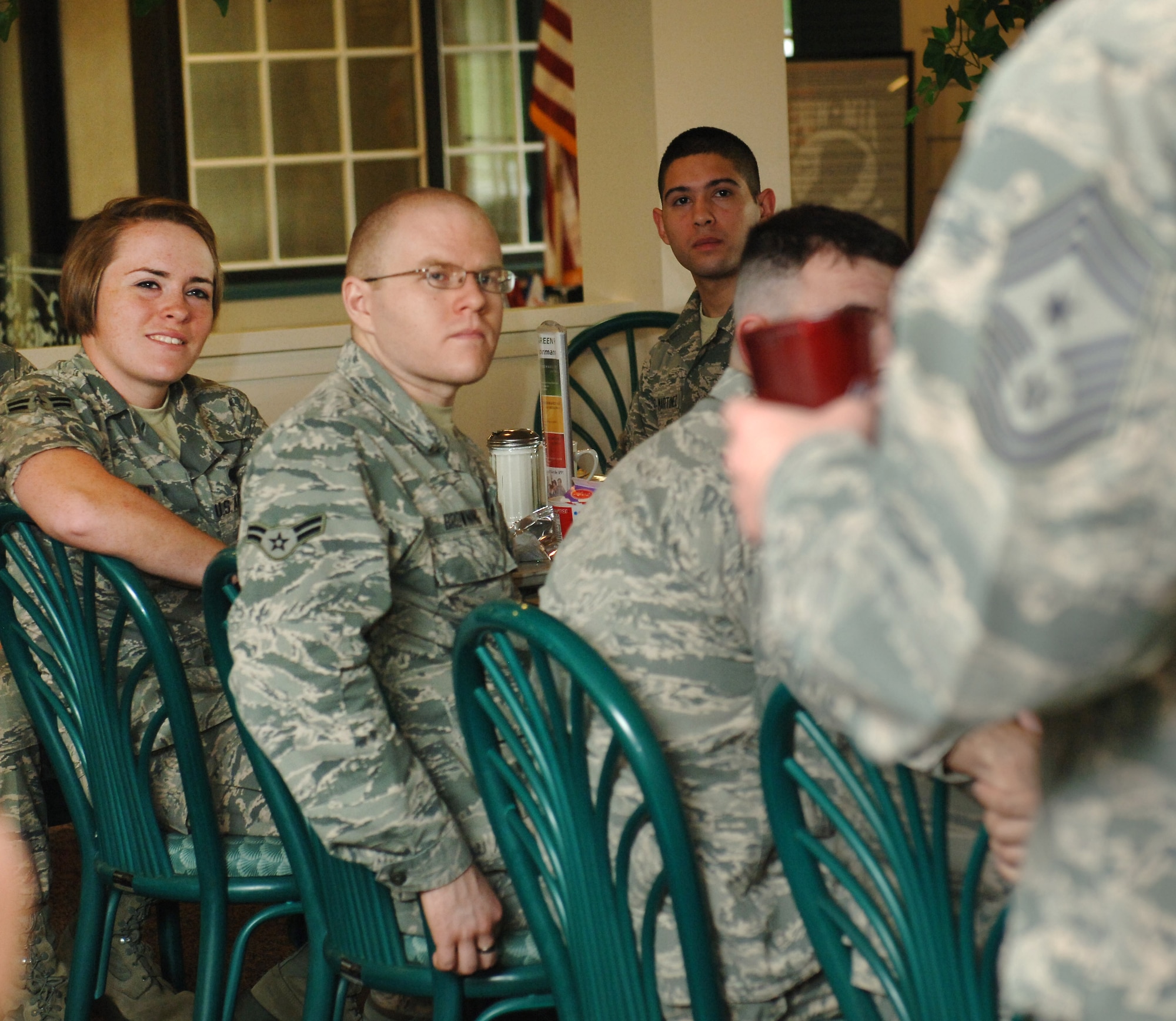 U.S. Air Force Airman 1st Class Samantha Dexheimer, 83rd Network Operations Squadron infrastructure cyber transport technician, asks Chief Master Sgt. Douglas McIntyre, Air Force Space Command command chief, a question at Langley Air Force Base, Va., May 15, 2015. McIntyre spoke with Airmen about the importance of job knowledge and performance for success in today’s Air Force. (U.S. Air Force photo by Staff Sgt. Teresa J. Cleveland/Released) 
