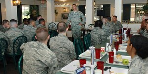 U.S. Air Force Chief Master Sgt. Douglas McIntyre, Air Force Space Command command chief, eats breakfast and speaks with Airmen from the 83rd Network Operations Squadron at Langley Air Force Base, Va., May 15, 2015. During his visit, McIntyre also had lunch with noncommissioned officers and spoke to the Airmen about being “World Champions.” (U.S. Air Force photo by Staff Sgt. Teresa J. Cleveland/Released)