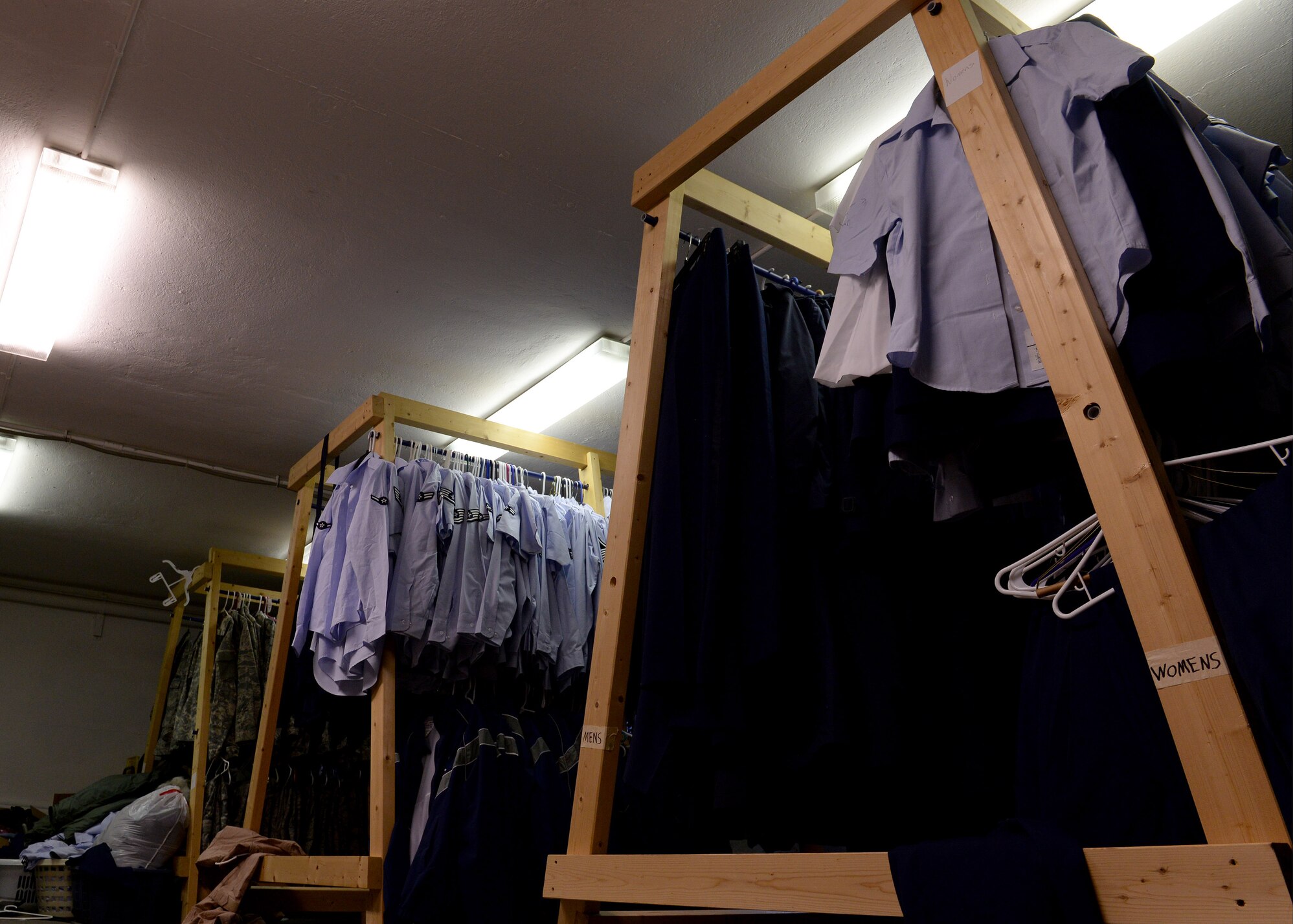 Uniform items hang on display inside the Airman’s Attic, May 19, 2015, at Aviano Air Base, Italy.  The attic offer various uniform items, such as Airman Battle Uniforms, service dress items and shoes available for Airmen at no cost.  (U.S. Air Force photo by Airman 1st Class Cary Smith/Released)