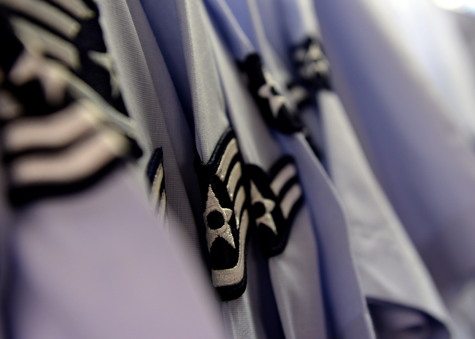 Uniform shirts hang on display inside the Airman’s Attic, May 19, 2015, at Aviano Air Base, Italy.  The attic also offers books, civilian clothes, children’s toys and household goods available for Team Aviano members at no cost. (U.S. Air Force photo by Airman 1st Class Cary Smith/Released)