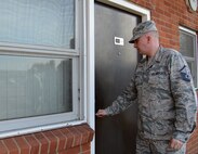 U.S. Air Force Master Sgt. Kenneth Oliver, 100th Civil Engineer Squadron Unaccompanied Housing superintendent from Woolwich, Maine, enters a dormitory to ensure the room is ready for occupancy March 24, 2015, on RAF Mildenhall, England. Oliver manages the dormitories with the help of four personnel — three assigned to his section, and one from the 352nd Special Operations Wing. The 100th CES renovates each dormitory periodically to ensure they are providing a good quality of life for Airmen who live there. (U.S. Air Force photo by Gina Randall/Released)