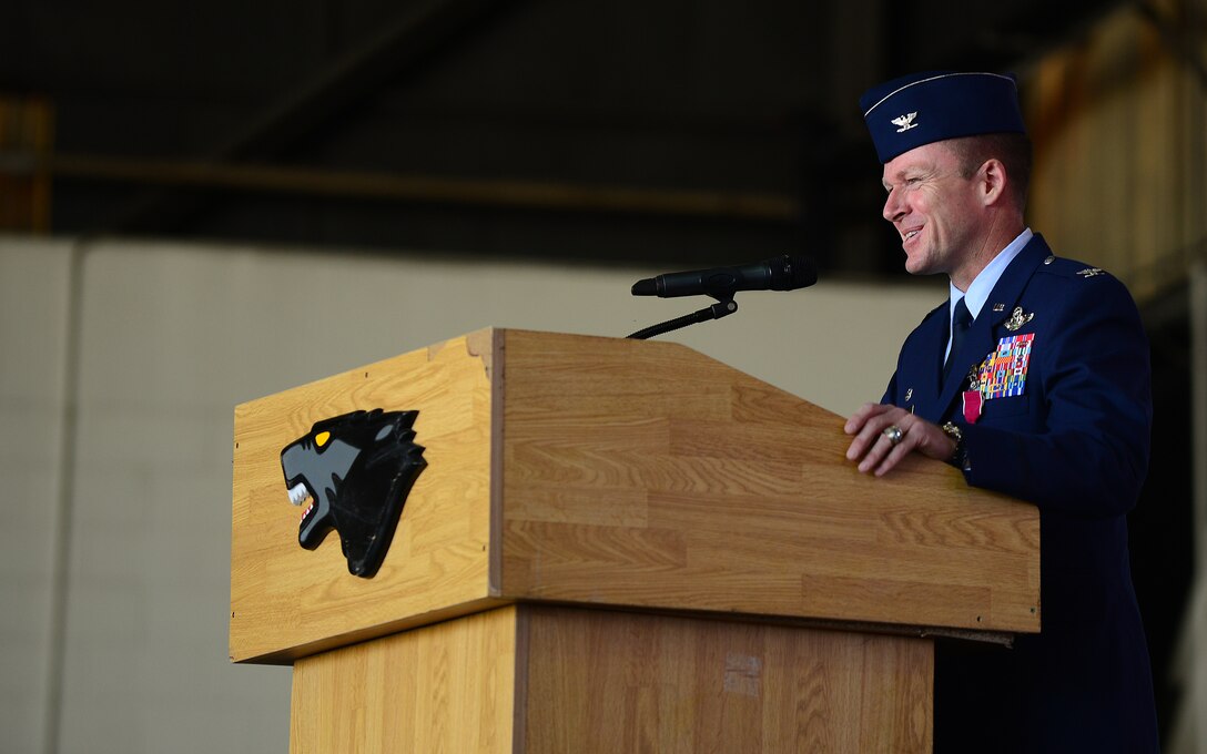 Col. Ken Ekman, 8th Fighter Wing outgoing commander, speaks before relinquishing command during the 8th FW change of command ceremony at Kunsan Air Base, Republic of Korea, May 21, 2015. Ekman’s next assignment will be at Peterson Air Force Base, Colo., as the vice operations director for the North American Aerospace Defense Command. (U.S. Air Force photo by Staff Sgt. Nick Wilson/Released)