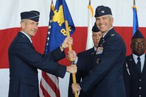 Lt. Gen. Terrence O’Shaughnessy, 7th Air Force and Air Component Command U.S. Forces Korea/U.S. Combined Forces commander, transfers command to Col.  Jeremy “Wolf” Sloane, 8th Fighter Wing commander, during the 8th FW change of command ceremony at Kunsan Air Base, Republic of Korea, May 21, 2015. Approximately 600 Wolf Pack Airmen looked on as Col. Ken Ekman, “Wolf” 54, relinquished command to Sloane. (U.S. Air Force photo by Senior Airman Divine Cox/Released)