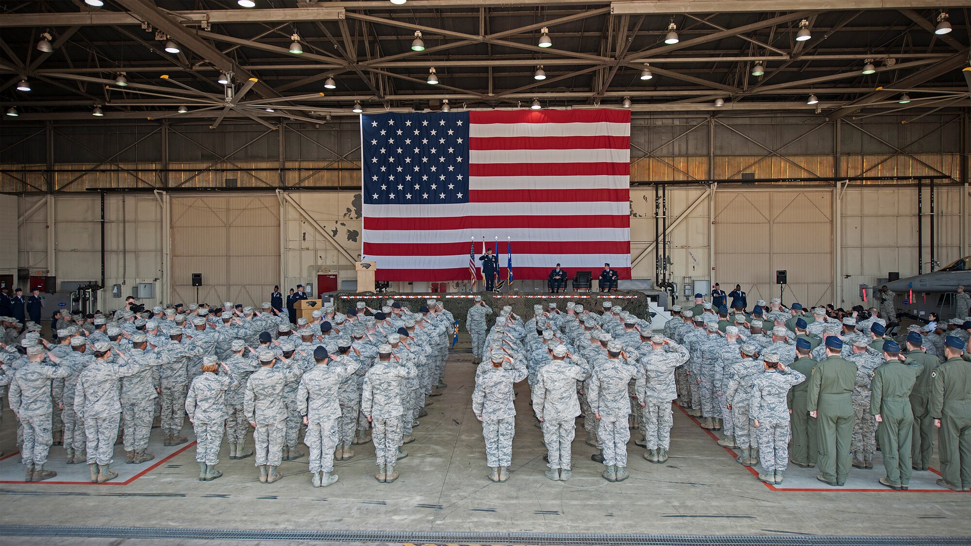 Col. Jeremy “Wolf” Sloane, 8th Fighter Wing commander, salutes the Wolf Pack for the first time during a change of command ceremony at Kunsan Air Base, Republic of Korea, May 21, 2015. Sloane accepted command from Lt. Gen. Terrence O’Shaughnessy, 7th Air Force and Air Component Command U.S. Forces Korea/U.S. Combined Forces commander during the ceremony. (U.S. Air Force photo by Senior Airman Katrina Heikkinen/Released)