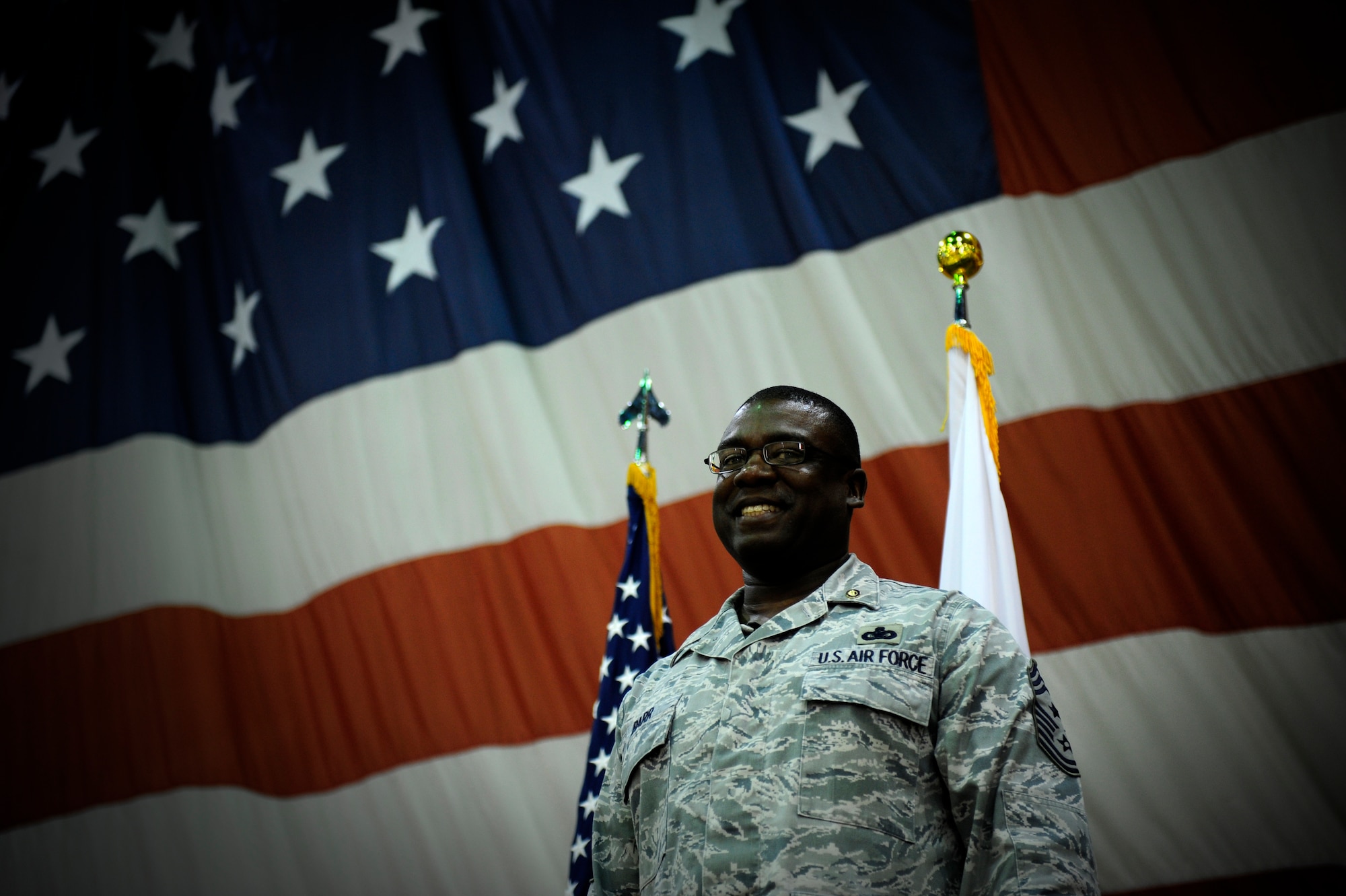 Chief Master Sgt. Lee Barr, 8th Fighter Wing command chief, smiles during his retirement ceremony at Kunsan Air Base, Republic of Korea, May 12, 2015. Barr spent 22 years in the security forces career field while supporting and deploying in Operations Desert Shield and Storm, Southern Watch, Noble Eagle, Iraqi Freedom and Odyssey Dawn. He will have served in the Air Force for 30 years when he retires in November. (U.S. Air Force photo by Senior Airman Taylor Curry/Released)