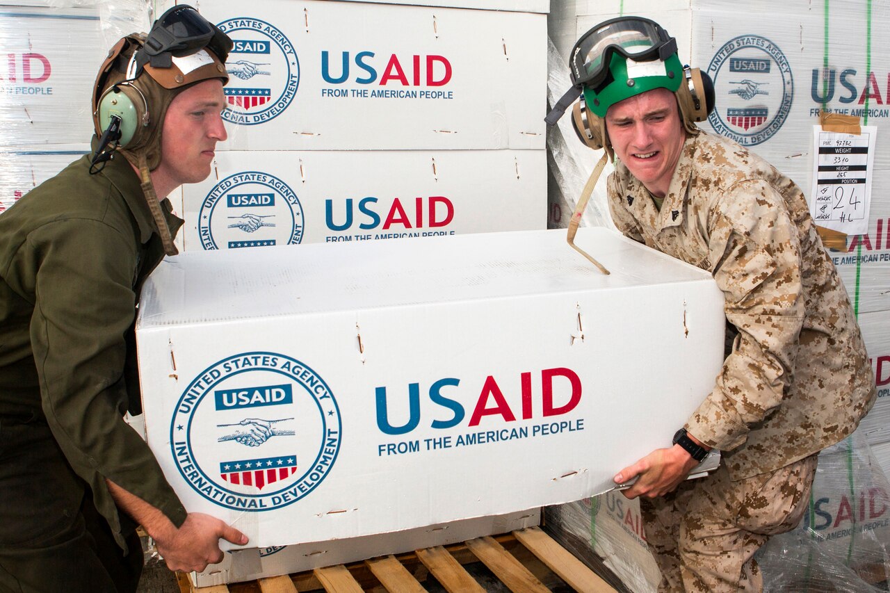 U.S. service members assigned to Joint Task Force 505 load aid and relief supplies onto an MV-22 Osprey at Tribhuvan International Airport, Kathmandu, Nepal, May 17, 2015. The supplies will be delivered to earthquake victims in remote areas of Nepal. U.S. Marine Corps photo by Staff Sgt. Jeffrey D. Anderson