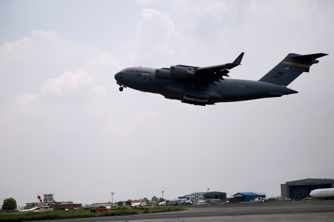 A U.S. Air Force C17 Globemaster III aircraft takes off from Tribhuvan International Airport in Kathmandu, Nepal, May 19, 2015. The plane is carrying a UH-1Y Huey helicopter, cargo and U.S. Marines back to Okinawa, Japan, as Operation Sahayogi Haat draws to a close.
