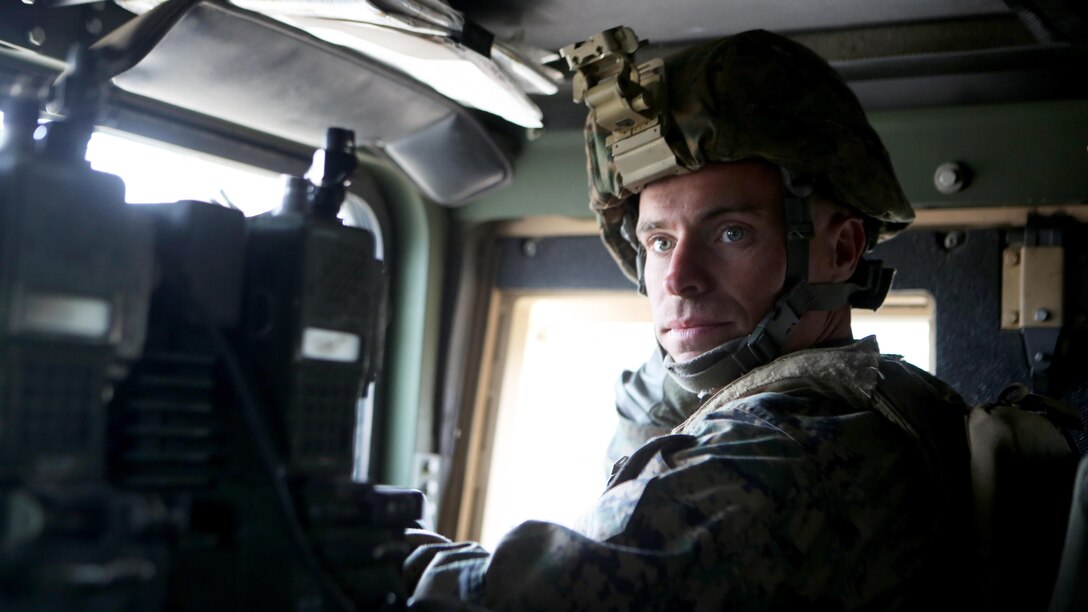 Staff Sgt. Andrew Zuehl, a radio chief with 1st Air Naval Gunfire Liaison Company, performs duties of vehicle commander during Exercise Maple Resolve 2015 aboard Canadian Manoeuvre Training Center, Camp Wainwright, Alberta, Canada, May 16, 2015. The multi-national exercise, conducted annually by the Canadian Army, is a three-week, high-readiness validation exercise for Canadian Army elements designated for domestic or international operations. This year, the 1st Canadian Army Division and the 5th Canadian Mechanized Battle Group are being supported by the British 12th Armoured Infantry Brigade, various U.S. Army elements, and for the first time, members of I MEF’s 1st ANGLICO who bring a unique capability to the table. (Photo by Cpl. Owen Kimbrel, U.S. Marine Corps)