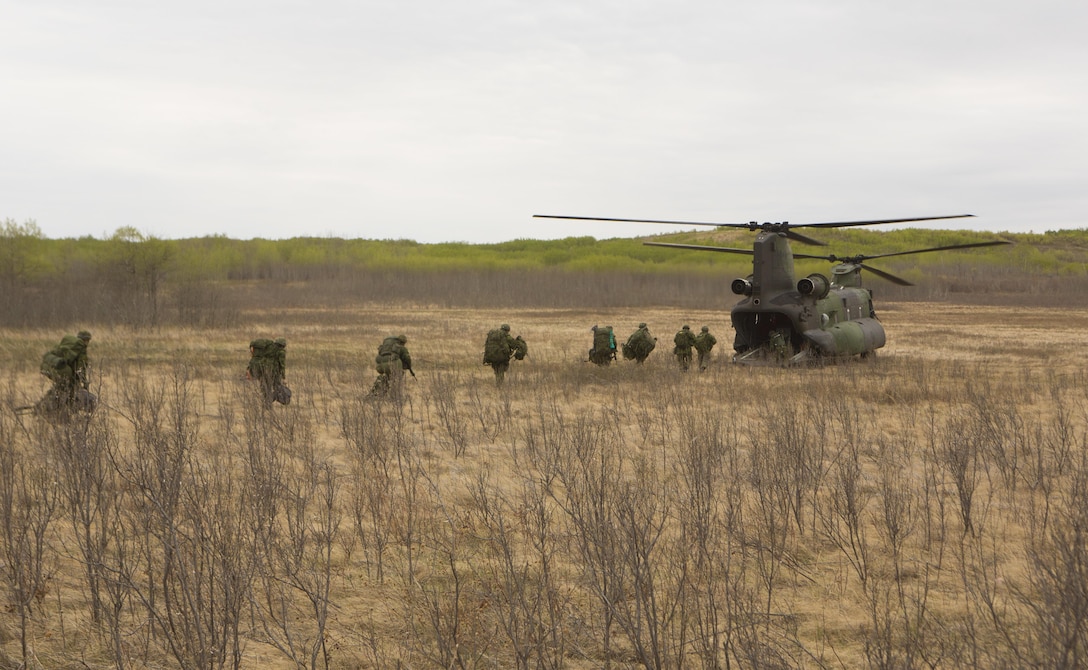 A CH-147F Chinook with 450 Tactical Helicopter Squadron, Royal Canadian Air Force, prepares to transport Soldiers from the Canadian Army during Exercise Maple Resolve 2015 aboard Canadian Manoeuvre Training Center, Camp Wainwright, Alberta, Canada, May 16, 2015. The multi-national exercise, conducted annually by the Canadian Army, is a three-week, high-readiness validation exercise for Canadian Army elements designated for domestic or international operations. This year, the 1st Canadian Army Division and the 5th Canadian Mechanized Battle Group (5 CMBG) are being supported by the British 12th Armoured Infantry Brigade, various U.S. Army elements, and for the first time, members of  I MEF’s 1st ANGLICO who bring a unique capability to the table. (Photo by Cpl. Owen Kimbrel, U.S. Marine Corps)