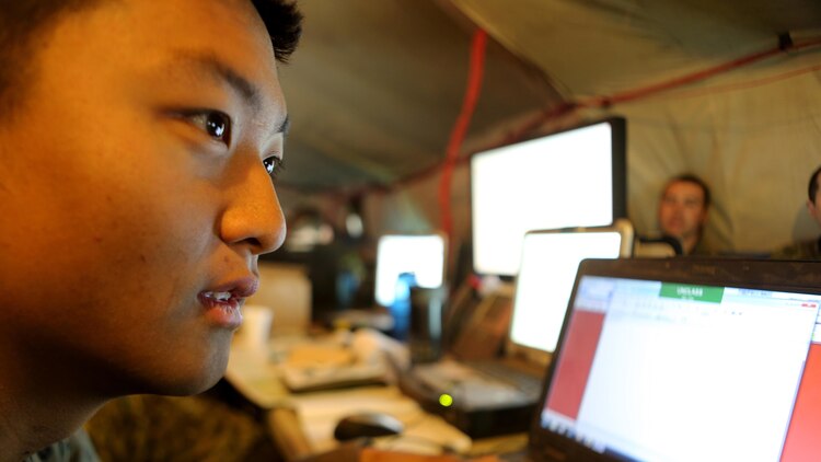 Lance Cpl. James Son, a joint fires observer with 1st Air Naval Gunfire Liaison Company, prepares to send a situation report to higher command during Exercise Maple Resolve 2015 aboard Canadian Manoeuvre Training Center, Camp Wainwright, Alberta, Canada, May 16, 2015. The multi-national exercise, conducted annually by the Canadian Army, is a three-week, high-readiness validation exercise for Canadian Army elements designated for domestic or international operations. This year, the 1st Canadian Army Division and the 5th Canadian Mechanized Battle Group are being supported by the British 12th Armoured Infantry Brigade, various U.S. Army elements, and for the first time, members of  I MEF’s 1st ANGLICO who bring a unique capability to the table. (Photo by Cpl. Owen Kimbrel, U.S. Marine Corps)