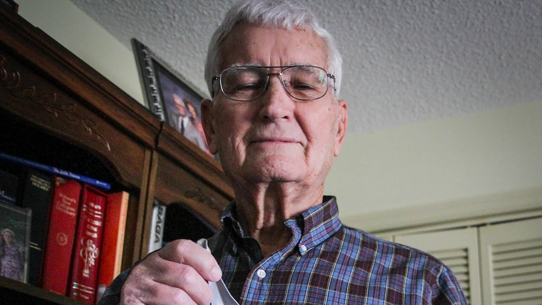 Retired U.S. Air Force Lt. Col. Arthur T. Ballard shows the cup and spoon he used for six and a half years as a prisoner of war in the infamous Hoa Lo prison, aka the "Hanoi Hilton". Ballard, an F-105 fighter pilot with 68 combat missions under his belt, was shot down and captured on Sept. 26, 1966. "I think it was small arms fire, maybe 32 or 57 millimeter. The sky just filled up with that stuff. I don't remember a whole lot about the bailout. I woke up on the ground with a broken leg, and a rifle stuck in my face." He was finally released on March 4, 1973.