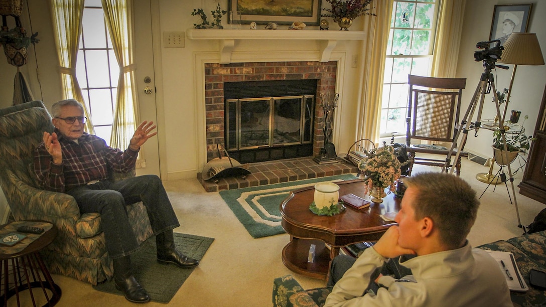 Former U.S. Marine Staff Sgt. Robert A. Henderson, 95, a Pearl Harbor survivor, tells Clemson University student Will Hines his story for the Veterans Project, an undergraduate research project, Feb. 21, 2015. The project was started to assist the Library of Congress collect, preserve and make accessible the personal accounts of American war veterans. "The first plane flew so close to me I could have thrown a rock and hit it," said Henderson. He would go on to serve 51 months in combat during WWII, culminated with the Battle of Okinawa. "I was in the first and last battles of the war," he said.