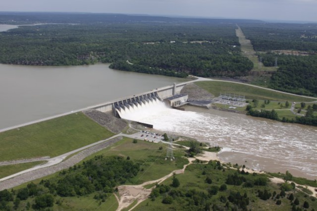 Aerial view of water being released from the Lake Eufaula Dam, May 13, 2015, at a rate of approximately 48,000 cubic feet per second. The flood control area behind the dam is normally kept empty. Currently, flood waters at the Lake Eufaula Dam, in Oklahoma are at 116 percent of capacity and operating over the flood pool into the surcharge pool.