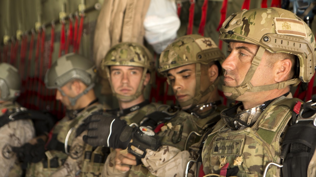 Spanish paratroopers sit in a KC-130J from Special-Purpose Marine Air-Ground Task Force Crisis Response-Africa during high-altitude jump training at Exercise Lone Paratrooper at Leόn Air Base, Spain, May 18, 2015. The multinational exercise integrated paratroopers from different countries to simultaneously conduct High Altitude Low Opening and High Altitude High Opening jumps to develop the partner nations’ interoperability.