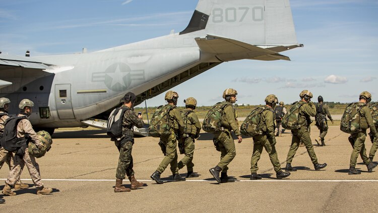 A multinational team of paratroopers board a KC-130J with Special-Purpose Marine Air-Ground Task Force Crisis Response-Africa during high-altitude jump training during Exercise Lone Paratrooper at Leόn Air Base, Spain, May 18, 2015. The multinational exercise integrated paratroopers from different countries to simultaneously conduct High Altitude Low Opening and High Altitude High Opening jumps to develop the partner nations’ interoperability.