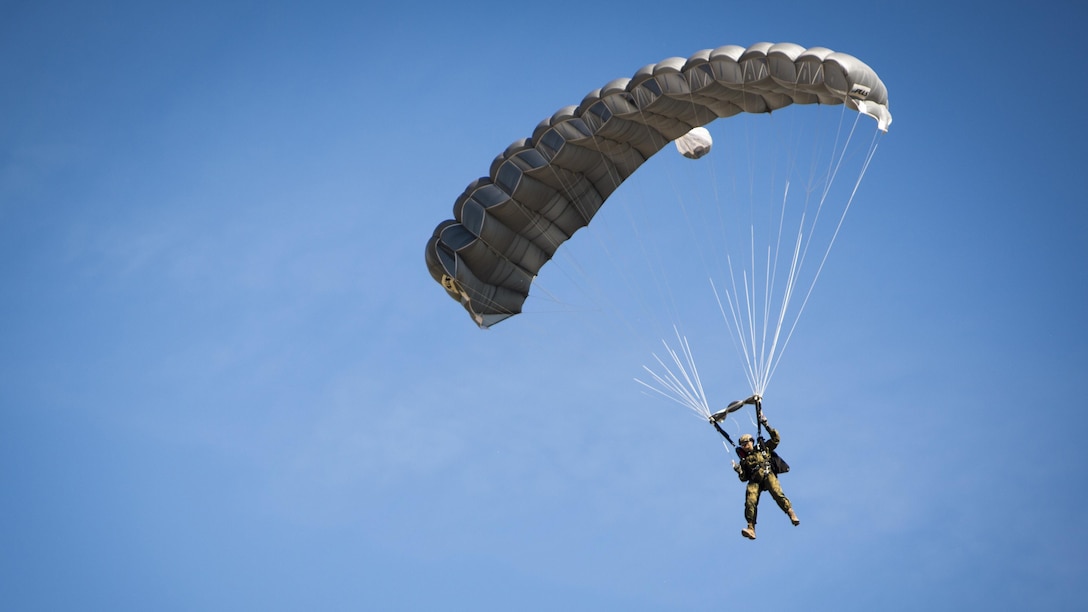 A paratrooper approaches the landing zone after jumping out of a KC-130J from Special-Purpose Marine Air-Ground Task Force Crisis Response-Africa during Exercise Lone Paratrooper at Leόn Air Base, Spain, May 18, 2015. A multinational force from Spain, Portugal, Brazil, Italy, France, Poland, the Netherlands, and the United States came together to conduct the exercise as a way to increase interoperability.