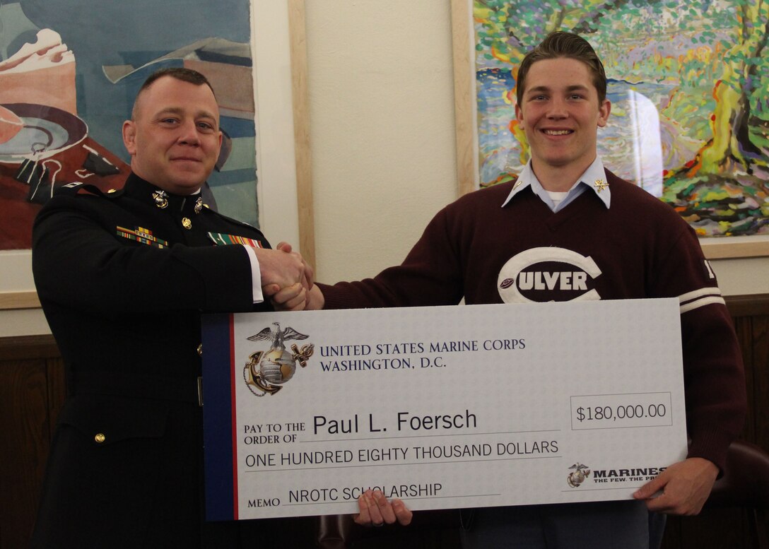 Capt. Matthew A. Lamb, Executive Officer of Recruiting Station Indianapolis presents the Naval Reserve Officer Training Corps Scholarship to Paul L. Foersch a senior at Culver Military Academy, Culver, IN. Scholarship selection is based on  commitments to the classroom, community and physical fitness.