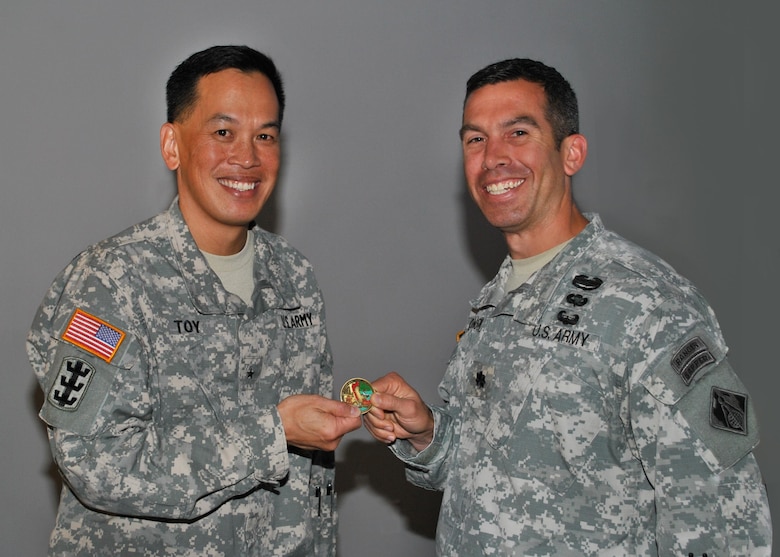 U.S. Army Corps of Engineers San Francisco District, Deputy Commander Lt. Col. Adam J. Czekanski, presents a district coin to thank the South Pacific Division Commander, Brig. Gen. Mark Toy for taking time to share both his personal and professional experiences as part of our Asian-Pacific American Heritance Month observance.

