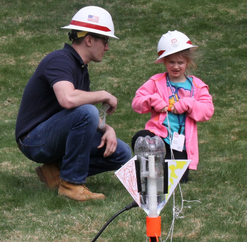Mike Riccio uses hands-on activities to teach children about propulsion during Take Your Daughters and Sons to Work Day.  