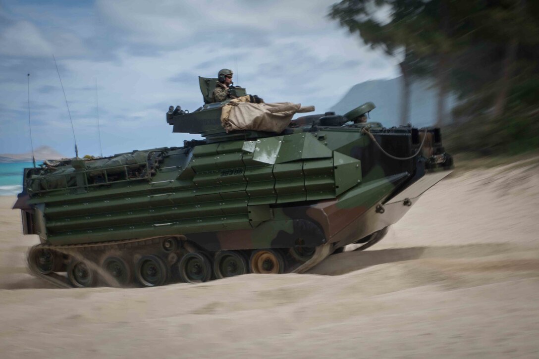 Amphibious assault vehicles, launched from the USS Rushmore, demonstrated amphibious landings as part of the U.S. Pacific Fleet’s joint sea-basing exercise, Culebra Koa 15, May 19, 2015. Observed by local-based military and representatives from 22 countries within the Indo-Asia-Pacific region, the landing was made in conjunction with the inaugural U.S. Marine Corps Forces Pacific-hosted U.S. Pacific Command Amphibious Leaders Symposium. (U.S. Marine Corps photo by Cpl. Brittney Vella/Released)