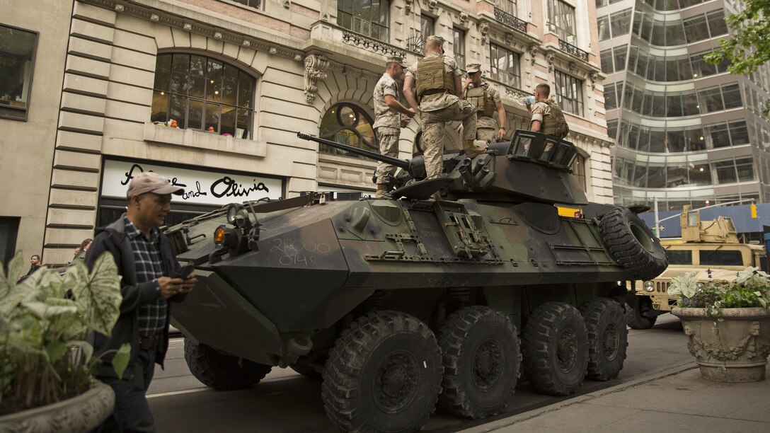 Marines with 2nd Light Armored Reconnaissance Battalion arrive to put their Light Armored Vehicle on display for the public to look at as a part of Marine Day at Bryant Park, New York City, May 21, 2015. Marines with Special-Purpose Marine Air Ground Task Force-New York showcase the capabilities of the Marine Corps both physically, mentally and technologically during Fleet Week New York. Fleet Week is an annual event that provides New York and surrounding area a chance to see the sea services capabilities.
