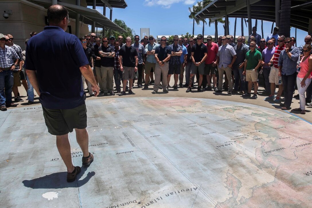 U.S. Marines with the 15th Marine Expeditionary Unit’s Maritime Raid Force begin a tour of the USS Arizona Memorial at Pearl Harbor in Honolulu, Hawaii, May 16, 2015. The Marines visited the museums and monument during their training and learned about the history and significance of the Pearl Harbor attack on Dec. 7, 1941. (U.S. Marine Corps photo by Cpl. Anna Albrecht/Released)