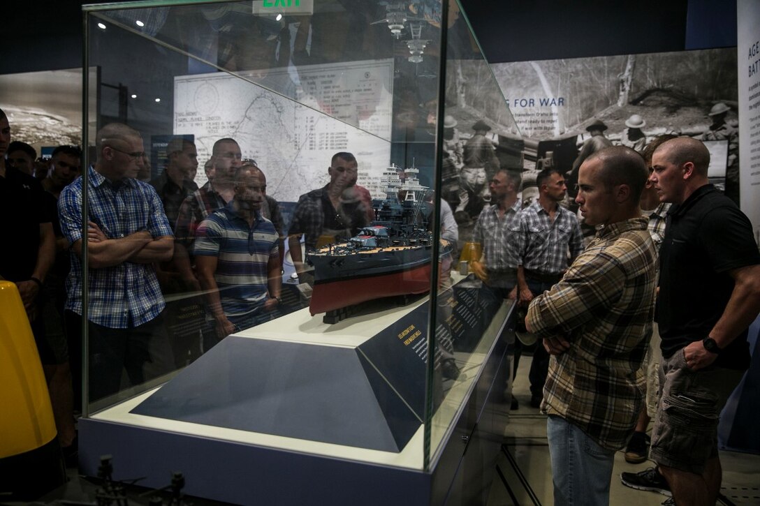 U.S. Marines with the 15th Marine Expeditionary Unit’s Maritime Raid Force look at a replica of the USS Arizona while visiting the memorial at Pearl Harbor in Honolulu, Hawaii, May 16, 2016. The ship was bombed on Dec. 7, 1941, killing 1,177 crewmen. (U.S. Marine Corps photo by Cpl. Anna Albrecht/Released)