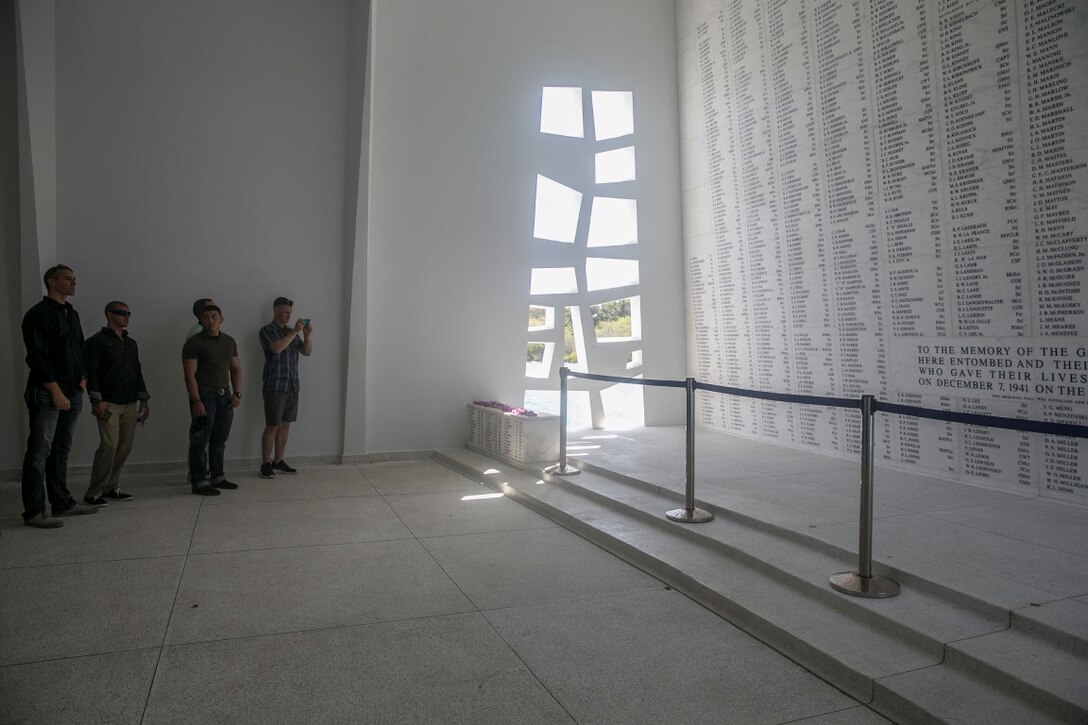 U.S. Marines with the 15th Marine Expeditionary Unit’s Maritime Raid Force visit the USS Arizona Memorial at Pearl Harbor in Honolulu, Hawaii, May 16, 2015. The memorial is built over the remains of the sunken battleship where 1,177 crewmen were killed on Dec. 7, 1941. (U.S. Marine Corps photo by Cpl. Anna Albrecht/Released)