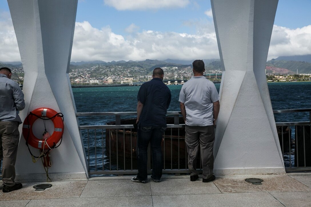 U.S. Marines with the 15th Marine Expeditionary Unit’s Maritime Raid Force begin a tour of the USS Arizona Memorial at Pearl Harbor in Honolulu, Hawaii, May 16, 2015. The memorial is built over the remains of the sunken battleship where 1,177 crewmen were killed on Dec. 7, 1941. (U.S. Marine Corps photo by Cpl. Anna Albrecht/Released)