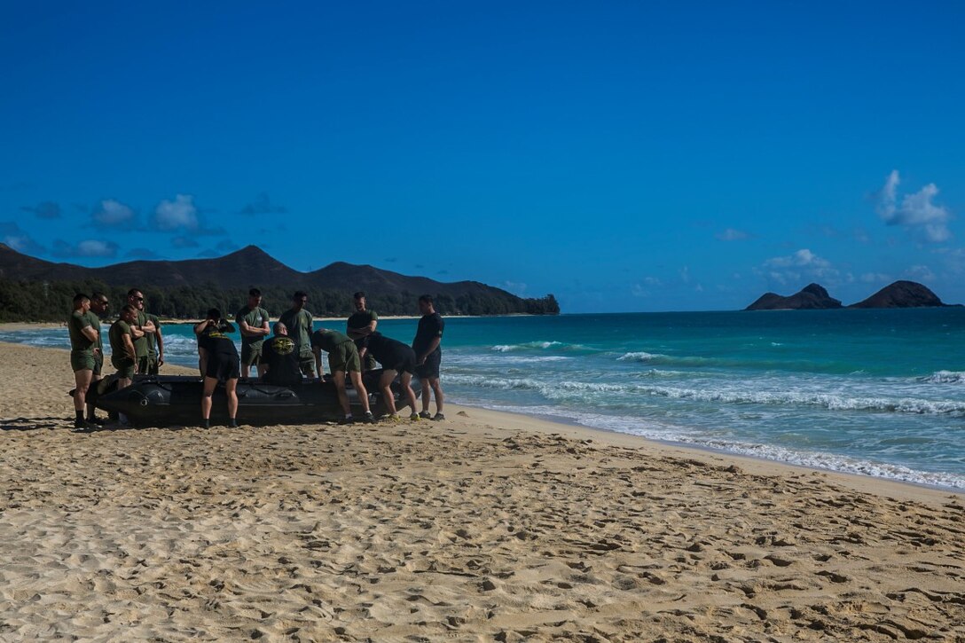U.S. Marines with the 15th Marine Expeditionary Unit’s Maritime Raid Force prepare to practice surf passage procedures aboard Bellows Air Force Station, Hawaii, May 15, 2015. The 15th MEU’s Force Reconnaissance Detachment helped familiarize the security element with the combat rubber raiding craft so they can effectively operate them during a mission. (U.S. Marine Corps photo by Cpl. Anna Albrecht/Released)