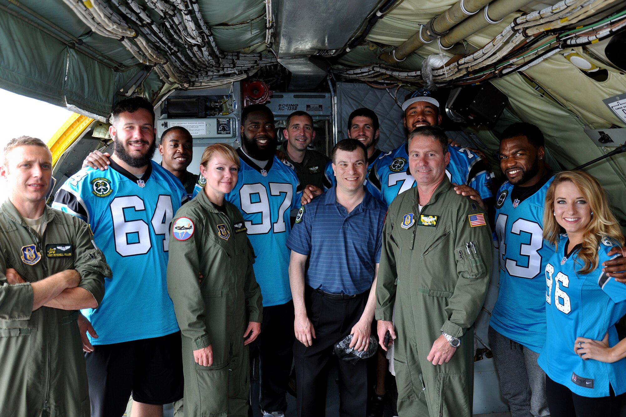 Members of the Carolina Panthers organization stand with 916th Air Refueling Wing Airmen after a KC-135R Stratotanker flight, Seymour Johnson Air Force Base, North Carolina, May 15, 2015. The Panthers group flew and observed 916th Airman operate as part of the Wings Over Wayne Airshow kick-off festivities. (USAF photo by Senior Airman Jeramy Moore, 916ARW/PA)