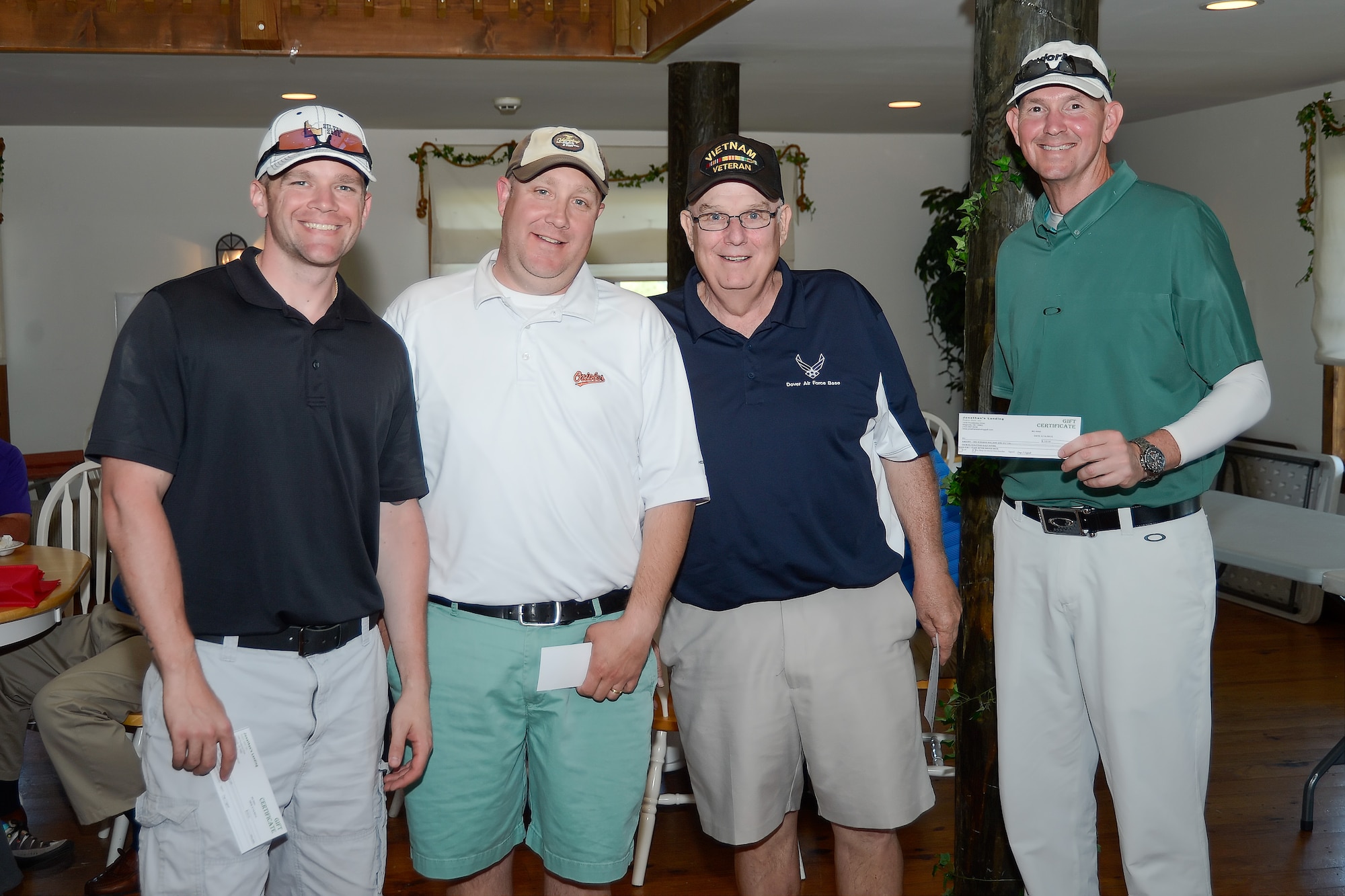 First place winners of the semi-annual Dover Bluesuiters Golf Tournament at Jonathan???s Landing Golf Course posing May 14, 2015, are: from left, Tech. Sgt. Nicholas Day, Kevin Yingling, Bill Hare and Senior Master Sgt. Steve Dirksen. Key military leaders from Dover Air Force Base were paired with local civic and business leaders for the tournament as part of Dover AFB's robust community outreach program. (U.S. Air Force photo/Greg L. Davis)