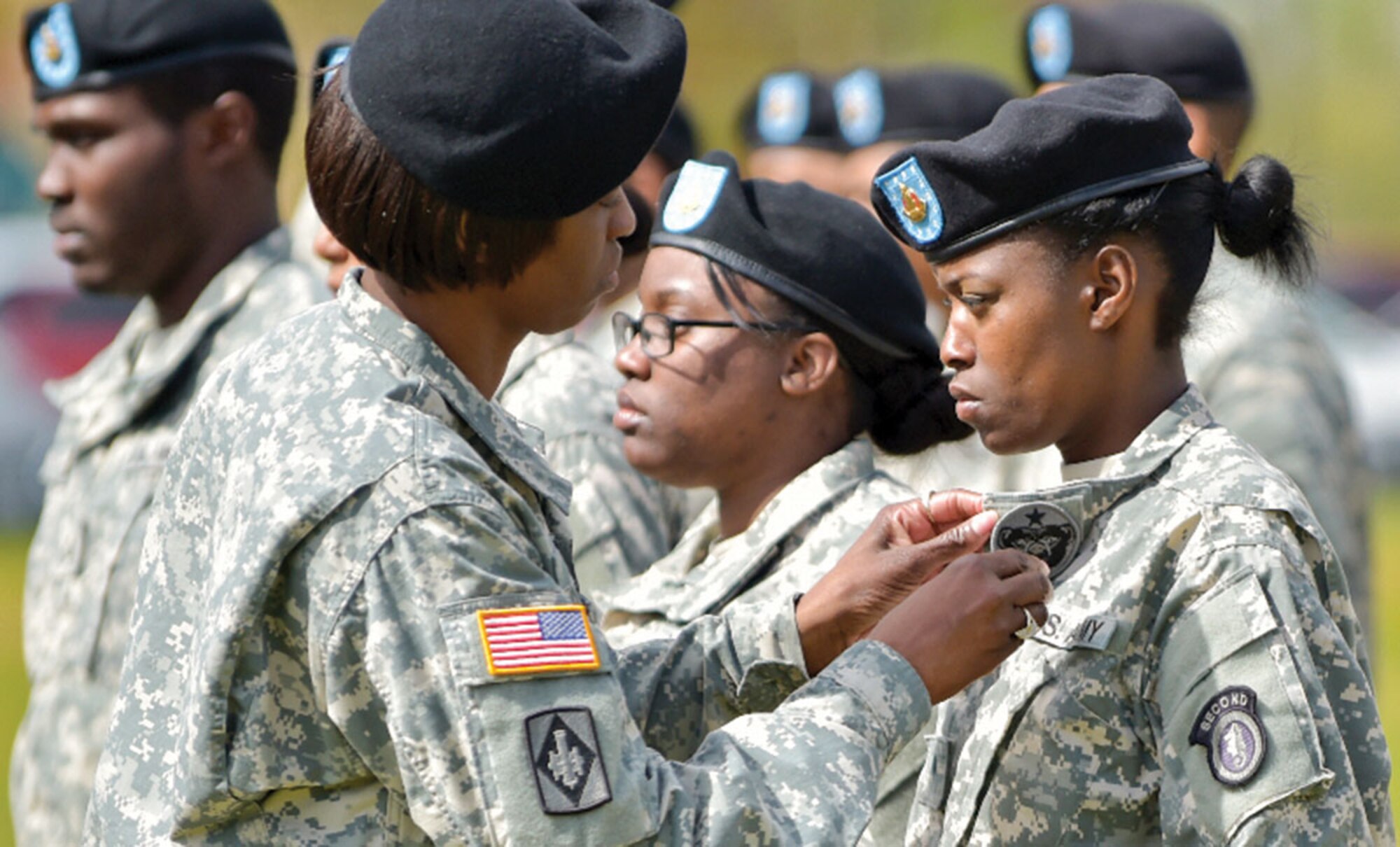 Soldiers of the 2nd Engineer Brigade, U.S. Army Alaska, change out their shoulder insignia for the USARAK insignia during a ceremony at Joint Base Elmendorf-Richardson May 15. This is the fourth time the 2nd Engineer Brigade has inactivated since World War II. The brigade is inactivating as part of downsizing to restructure into a leaner, more adaptable fighting force. (U.S. Air Force photo/Justin Connaher)